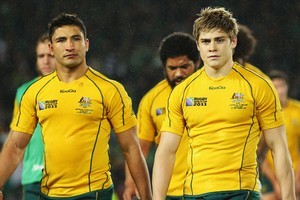 Anthony Fainga'a and James O'Connor walk off the ground after Australia's loss to Ireland. Photo / Getty Images