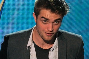 Robert Pattinson is recording a 'stripped-back' debut album.