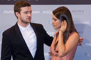 Justin Timberlake and Mila Kunis have denied reports that they've been sexting each other. Photo / AP