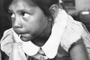 A new entrant takes comfort in her school milk in 1967. Photo / NZ Herald