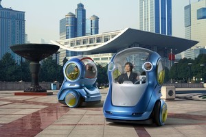 General Motors reckons its EN-V city concept can drop off passengers before finding a charging station by itself. Photo / Supplied