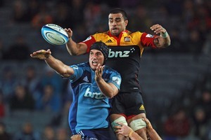 Anthony Boric of the Blues competes with Liam Messam of the Chiefs in a Super Rugby clash. Both franchises, as well as the other three in New Zealand, may soon be privately owned. Photo / Getty Images
