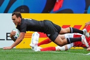 Wing Israel Dagg dives over to score the All Blacks' third try in their Rugby World Cup clash against Canada. Photo