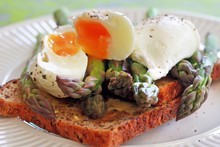 The first fresh spears of asparagus with grain bread and poached eggs is a surefire recipe for bliss. Photo / Doug Sherring