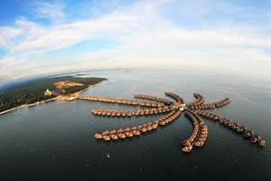 Opened in late 2010, the Golden Palm Tree Resort is built on a series of concrete piers and features 392 over-water villas. Photo / P.K. Stowers