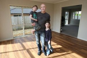 Craig Fellows and his children Grace, 6, and Cooper, 5, at home in Ohauiti. Their household goods and car are on Rena. Photo / Joel Ford/Bay of Plenty Times