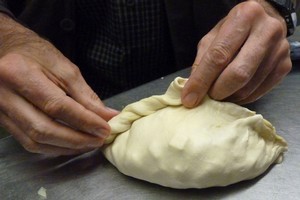 Jim Eagles puts the finishing touch to a Cornish Pasty at the Chough Bakery at Padstow. Photo / Chris Eagles