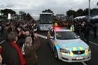 Rugby World Cup fans greet the All Blacks. Photo / Greg Bowker