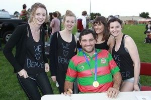Stephen Donald and his World Cup winner's medal with Beaver fans (from left) Emma Bennett, Clare Garvey, Sam Campbell and Hannah Bennett at the Waiuku Rugby Club yesterday. Photo / Steven McNicoll