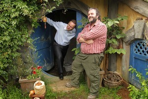 Prime Minister John Key gets an inside look at a hobbit house with director Sir Peter Jackson. Photo / Alan Gibson