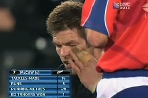 In this screenshot from the World Cup final broadcast, All Black captain Richie McCaw can be seen reacting to a possible eye gouge during the game.