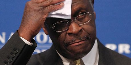 Republican presidential candidate, Herman Cain wipes his forehead before answering questions at a press conference last week when he was already facing questions about his past. Photo / AP