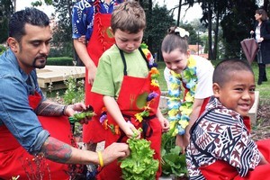Michael Meredith (left) visiting his local school's garden. Photo / Supplied