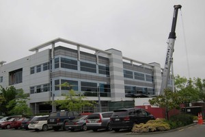 The Statistics NZ building in Madras Street which is being re-levelled with new "screw piles". Photo / Amanda Cropp