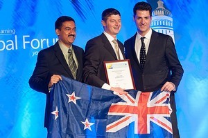 Chris Clay receives his award from Anthony Salcito - Vice President, Education Microsoft and Kapil Wadhera, General Manager, Intel. Photo / Supplied