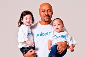 Rugby legend Jonah Lomu (with sons Brayley and Dhyreille) has become an Ambassador for UNICEF NZ. Photo / UNICEF
