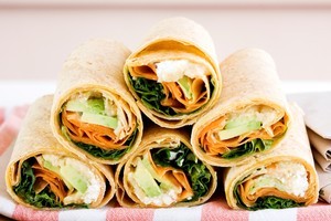 Avocado, hummus, feta and carrot wraps. Photo / Babiche Martens