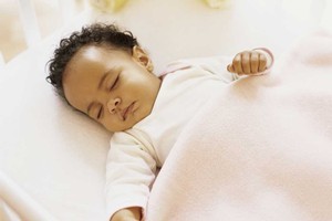 Sleeping your baby on their back is one way of preventing a sudden death. Photo / Thinkstock