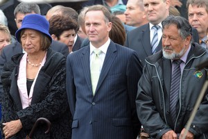 National MP Georgina te Heuheu, left, Prime Minister John Key and Maori Party co-leader Pita Sharples are welcomed onto the marae for the annual visit to Ratana Pa. Photo / NZPA