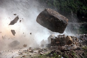 A huge boulder crashes across the mountain road before tumbling to the valley floor beyond. Photo / Brian Walker