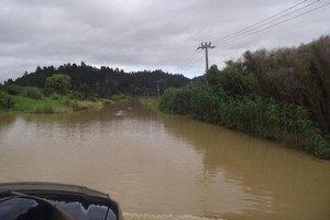 A Kaeo road is completely submerged. Photo / Clare Farrell