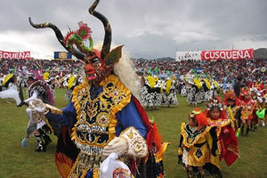 Dancers sporting false heads that caricature figures from Peruvian myth and history perform at the Candelaria dance and costume contest in Puno, south-eastern Peru. Photo / Wikimedia Commons image by user Aldoz