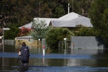 A local resident wades through flood waters from the Wimmera River in Dimboola, Australia. Photo / Getty Images A local resident wades through flood waters from the Wimmera River in Dimboola, Australia. Photo / Getty Images