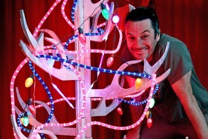 Justin Newcombe with his reindeer antler wooden Christmas tree and lighting. Photo / Sarah Ivey