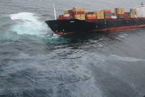 The oil can clearly be seen flowing from the Rena. The photo was taken during an observation flight this morning. PHoto / Maritime New Zealand