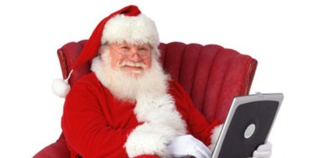 Santa took some time out of his busy pre-Christmas schedule to talk to the Herald Online - which he's seen checking here. Photo / Thinkstock