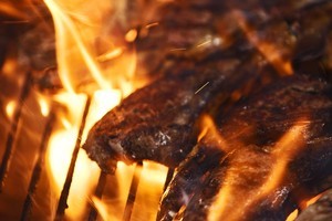 Big flames may create a spectacle but the remnants of burnt steaks and sausages may also leave a bad taste in your mouth. Photo / Thinkstock