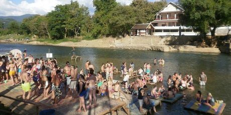 Tourists tubing down the river in Vang Viang, Laos. Photo / Charlotte Whale