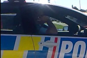 A reader's video of a policeman talking in Lincoln Road on Thursday. Photo / Supplied
