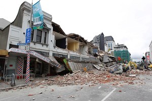 Collapsed buildings and debris along Manchester Street in Christchurch. Photo / Getty Images