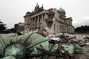 Weakened but relatively unscathed after last year's quake, the city's cathedral has suffered badly this time, losing its landmark spire and sustaining huge structural damage. Photo / NZPA