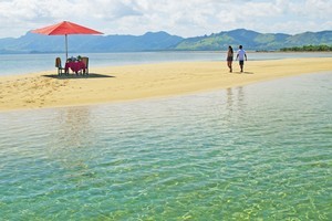 Picnicking on a succulent array of seafood and tropical fruit while perched on a sandbar is the perfect introduction to a stay at Nukubati. Photo / Supplied