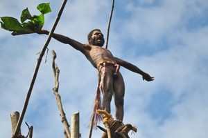 Thirty metres high above ground at Pentecost, a man prepares himself for the leap of faith. Photo / Susan Buckland
