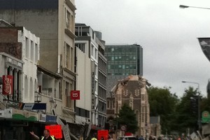One of the main streets in Christchurch is seen littered with rubble. Photo / @PolarBearFarm via Twitter