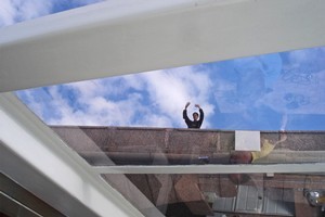 New-found friend Alexei waves to boat passengers from a bridge above the canal in St Petersburg. Photo / Bronwyn Elsmore
