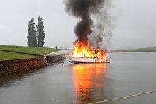 The blaze seems to have started when a problem with the boat's ignition caused petrol to catch fire. Photo / Katie Anderson