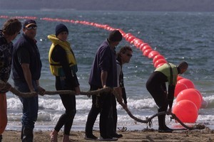 The Southern Cross cable comes ashore on Takapuna beach. Photo / Russell Smith