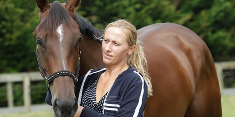 If Shez Sinsational, here with handler Selina Leef, wins the Auckland Cup she will automatically qualify to run in the Melbourne Cup. Photo / Richard Robinson