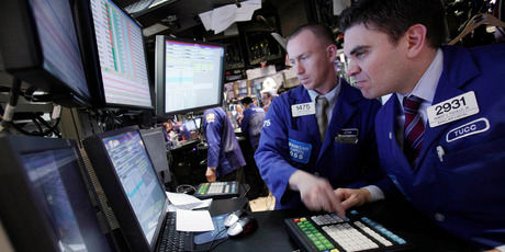 Specialists James Ahrens, left, and Robert Tuccillo work on the floor of the New York Stock Exchange. File photo / AP
