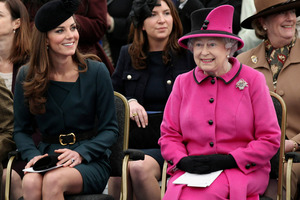 Britain's Queen Elizabeth II and Catherine, Duchess of Cambridge watch a fashion show at De Montfort University in Leicester, England. Photo / AP