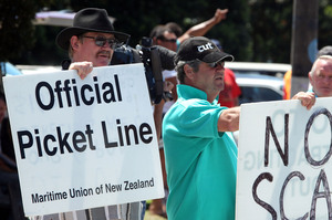 Members of the Maritime Union striking outside the Ports of Auckland over conditions and pay disputes. Photo / APN