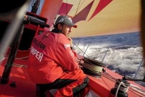 Andy McLean trimming onboard CAMPER with Emirates Team New Zealand during leg 4 of the Volvo Ocean Race. Photo / Hamish Cooper