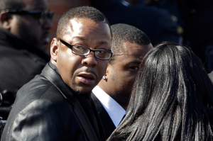 Singer Bobby Brown, left, is seen outside during the funeral of his ex-wife Whitney Houston in New Jersey. Photo / AP