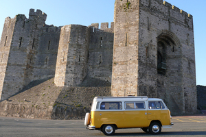 A Volkswagen camper at Carnaevon Castle in Wales. Photo / Creative Commons image by Flickr user Nigel Hook