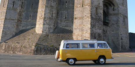 A Volkswagen camper at Carnaevon Castle in Wales. Photo / Creative Commons image by Flickr user Nigel Hook