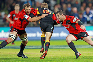 George Whitelock (L) and Corey Flynn of the Crusaders tackle Robbie Robinson of the Chiefs. Photo / Getty Images George Whitelock (L) and Corey Flynn of the Crusaders tackle Robbie Robinson of the Chiefs. Photo / Getty Images